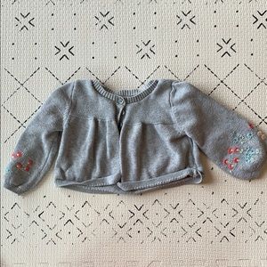 Girls sweater with embroidered sleeves